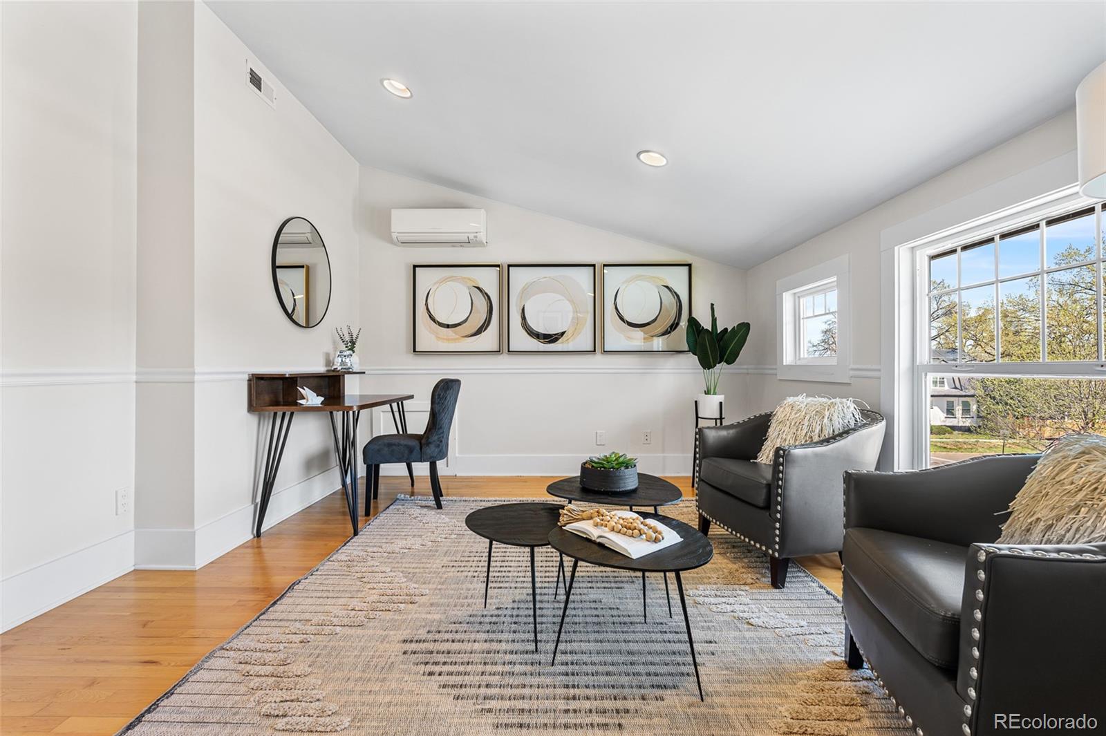 1065 Jackson Street Denver, CO 80206 - Photo 34 of 50 a living room with furniture and a large window