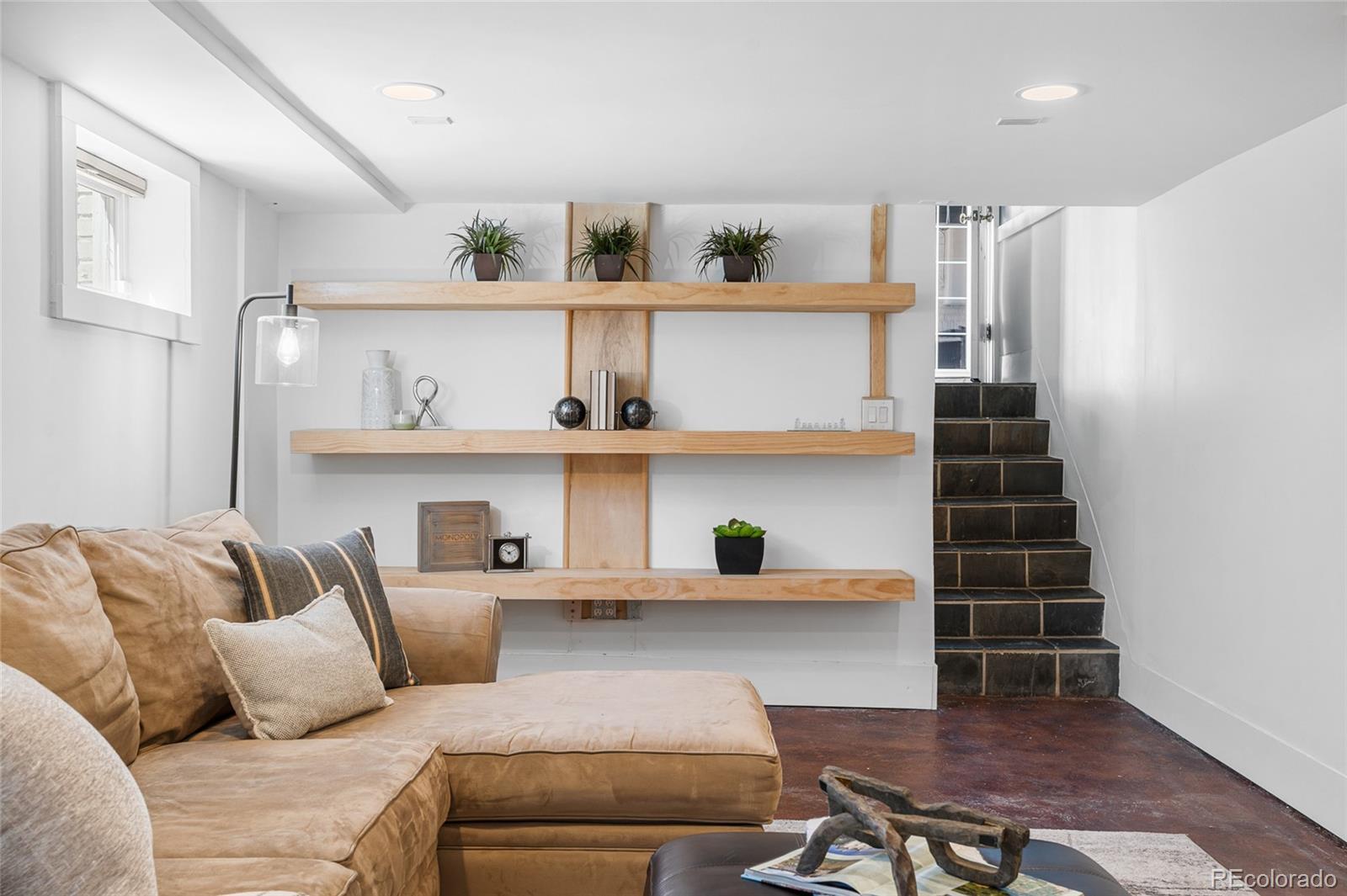 1065 Jackson Street Denver, CO 80206 - Photo 36 of 50 a living room with furniture and wooden floor