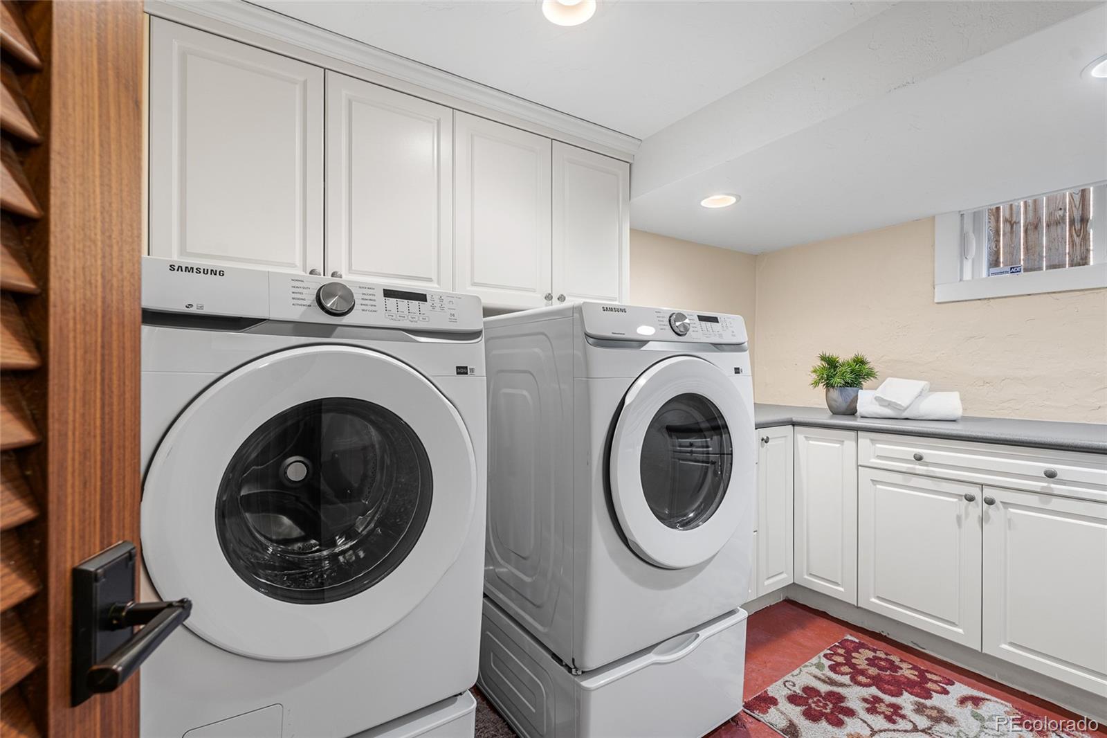 1065 Jackson Street Denver, CO 80206 - Photo 37 of 50 a utility room with dryer and washer