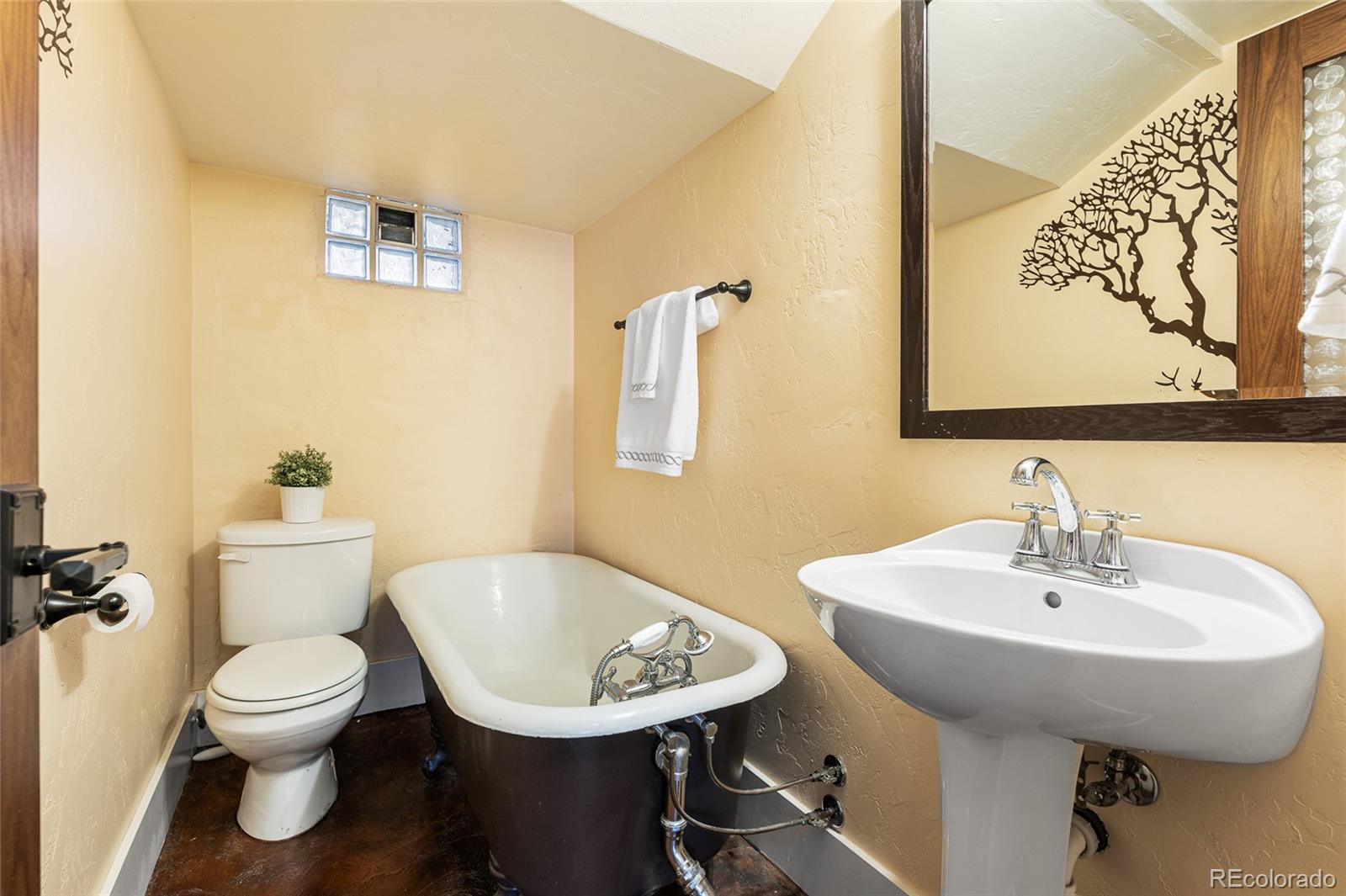 1065 Jackson Street Denver, CO 80206 - Photo 38 of 50 a bathroom with a toilet sink and mirror