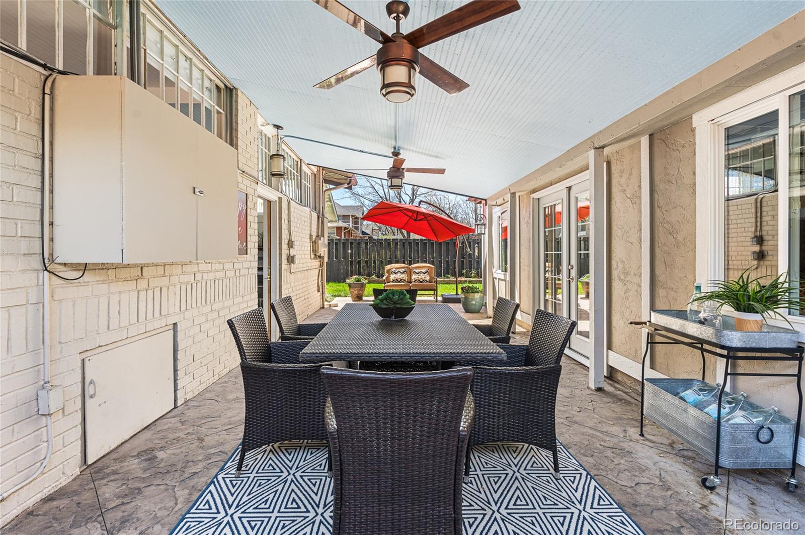 1065 Jackson Street Denver, CO 80206 - Photo 40 of 50 a view of a dining room with furniture window and wooden floor