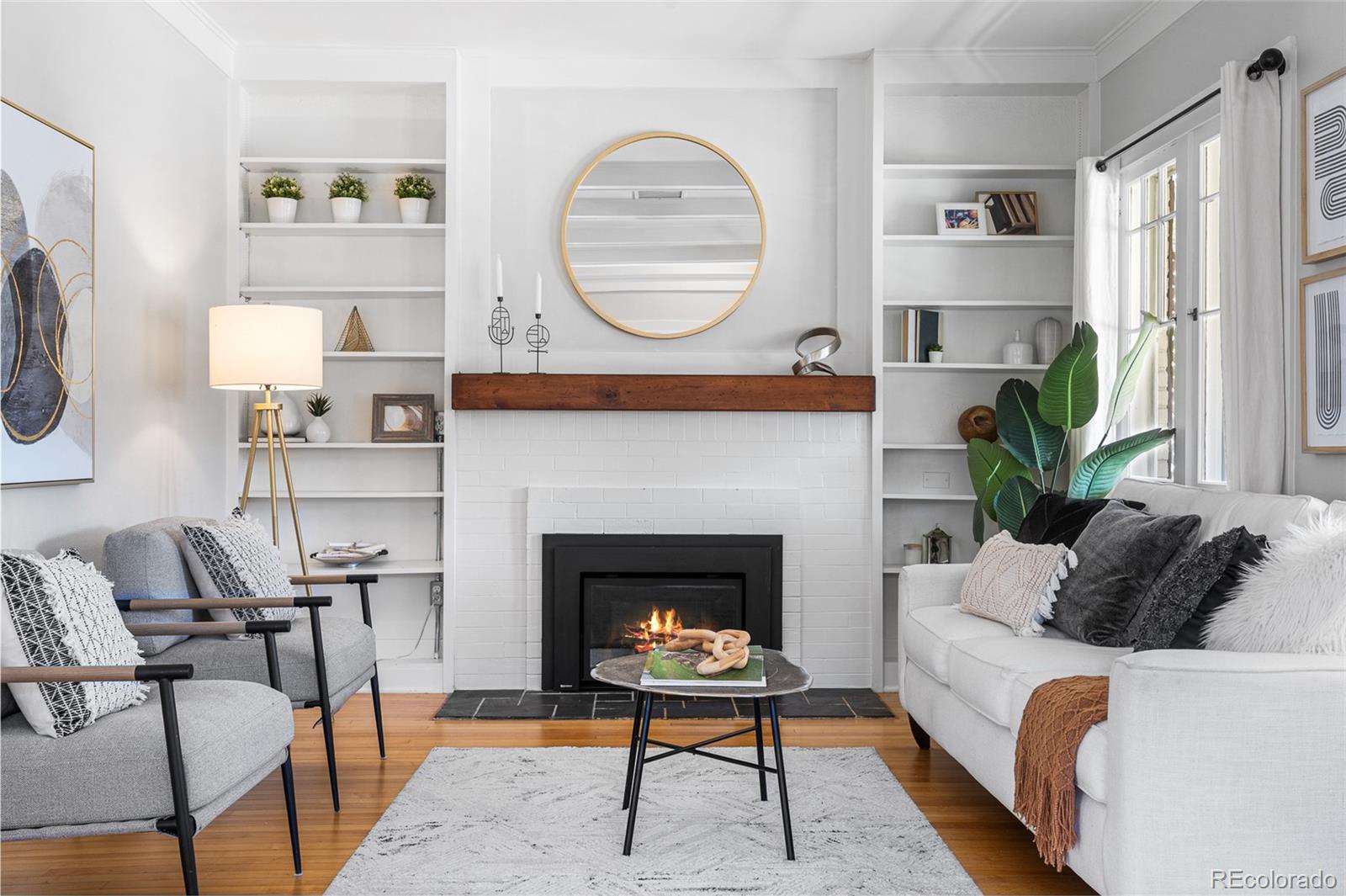 1065 Jackson Street Denver, CO 80206 - Photo 4 of 50 a living room with furniture and a fireplace