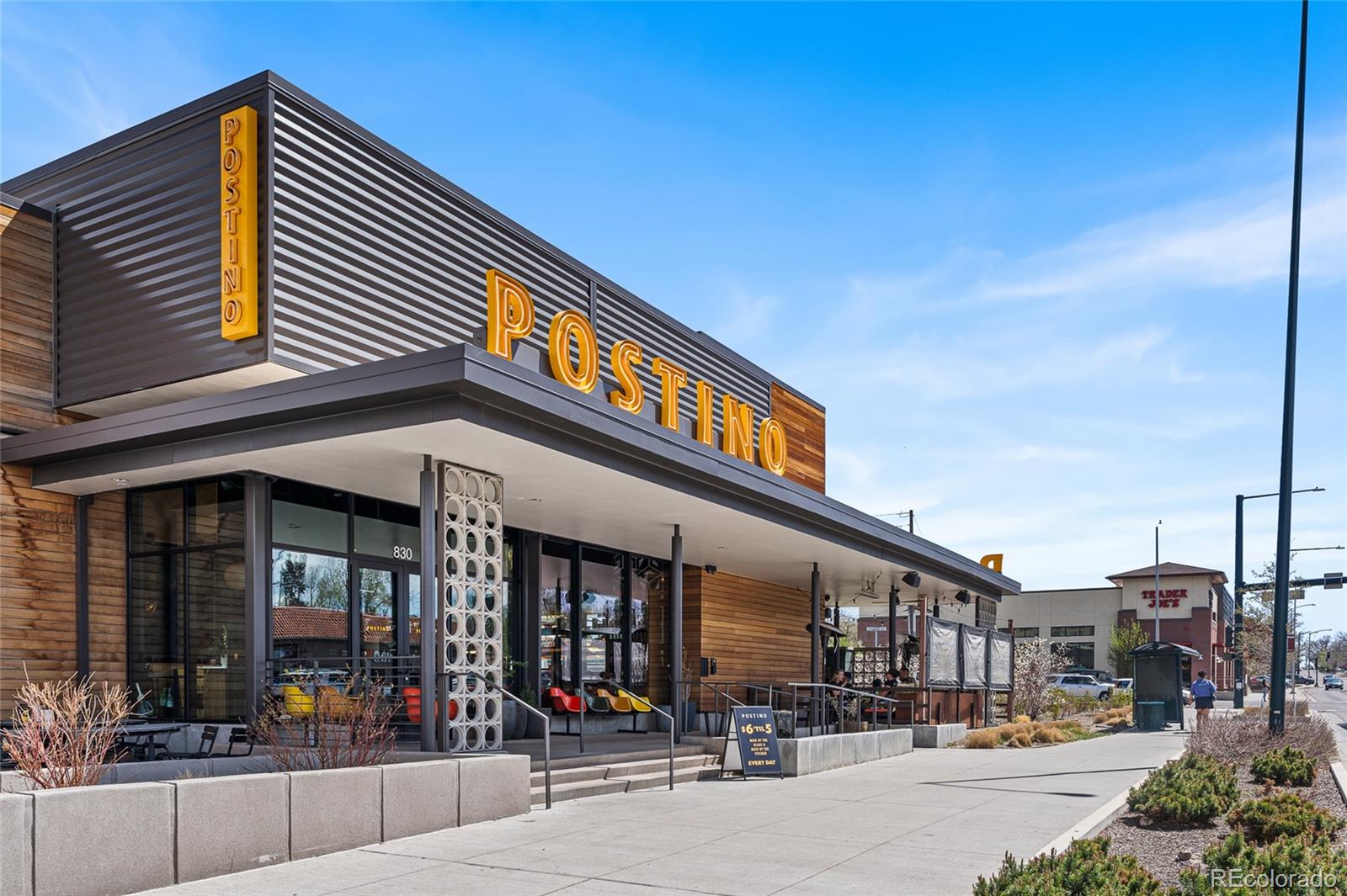 1065 Jackson Street Denver, CO 80206 - Photo 50 of 50 a city street lined with tall buildings and cars parked