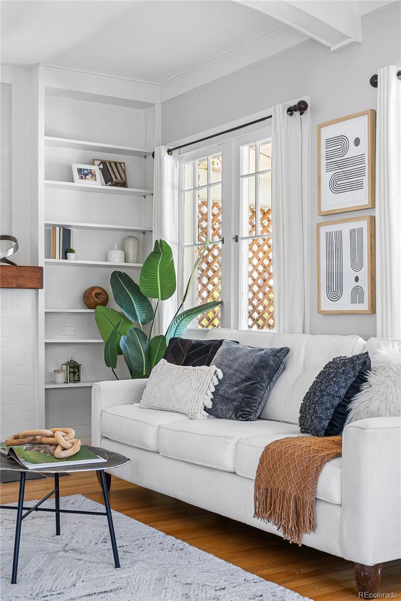 1065 Jackson Street Denver, CO 80206 - Photo 5 of 50 a living room with furniture and a potted plant