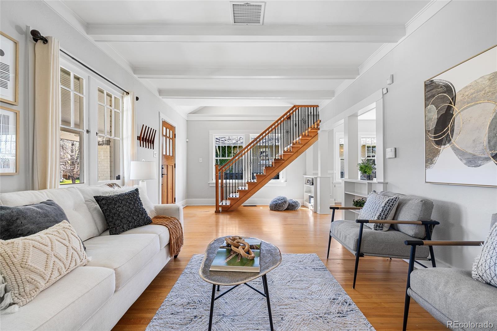 1065 Jackson Street Denver, CO 80206 - Photo 6 of 50 a living room with furniture and wooden floor