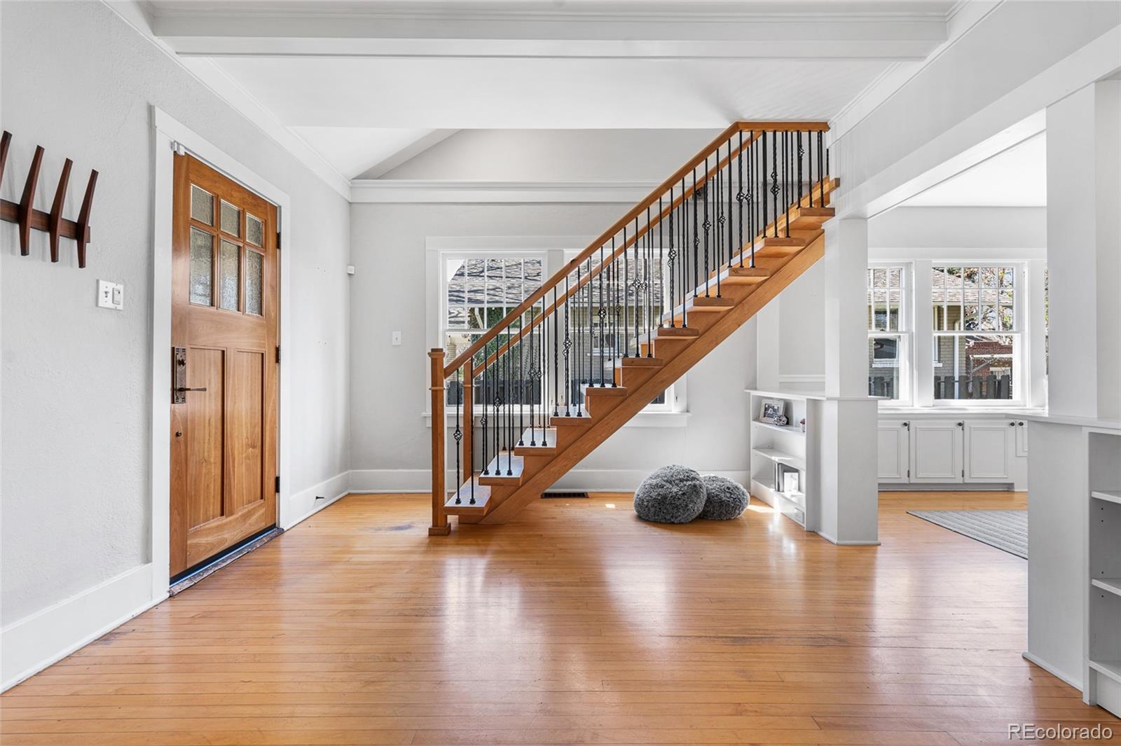1065 Jackson Street Denver, CO 80206 - Photo 7 of 50 a view of entryway and hall with wooden floor