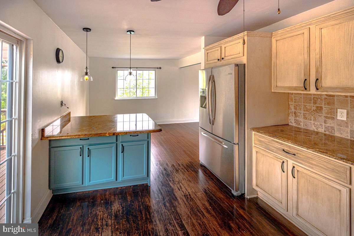892 Estates Boulevard Hamilton, NJ 08690 - Photo 11 of 36 a kitchen with granite countertop a refrigerator and a sink
