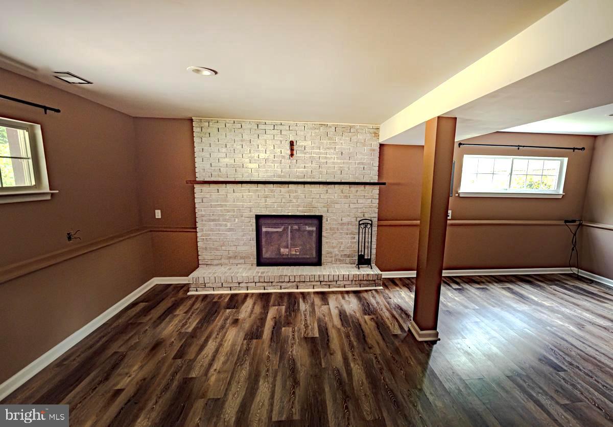 892 Estates Boulevard Hamilton, NJ 08690 - Photo 12 of 36 a view of an empty room with a fireplace and a window