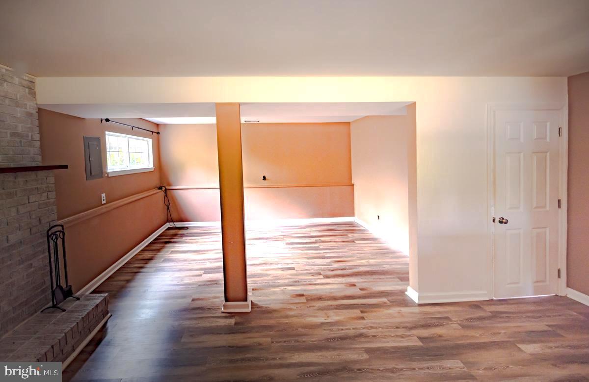 892 Estates Boulevard Hamilton, NJ 08690 - Photo 13 of 36 a view of a hallway with wooden floor and staircase
