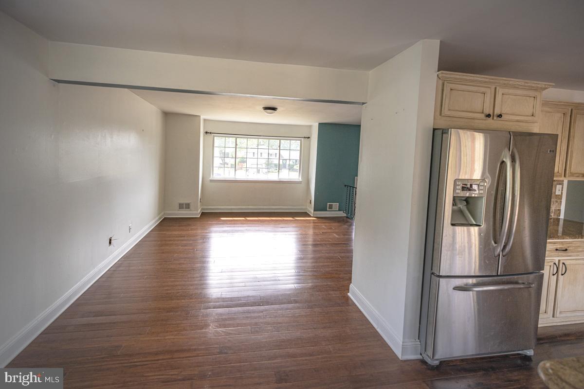 892 Estates Boulevard Hamilton, NJ 08690 - Photo 17 of 36 a view of a kitchen with wooden floor and electronic appliances