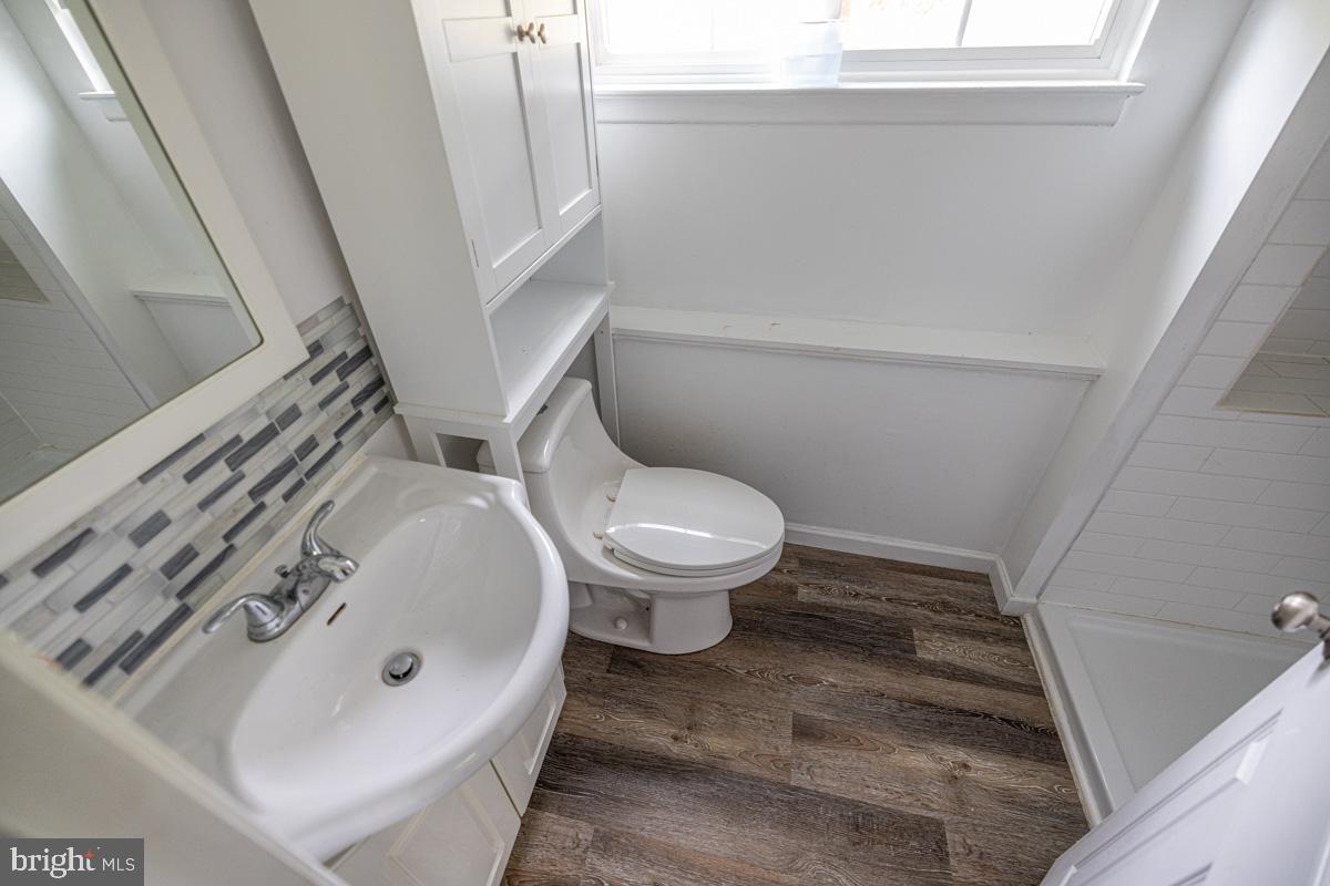 892 Estates Boulevard Hamilton, NJ 08690 - Photo 19 of 36 a white toilet sitting next to a sink