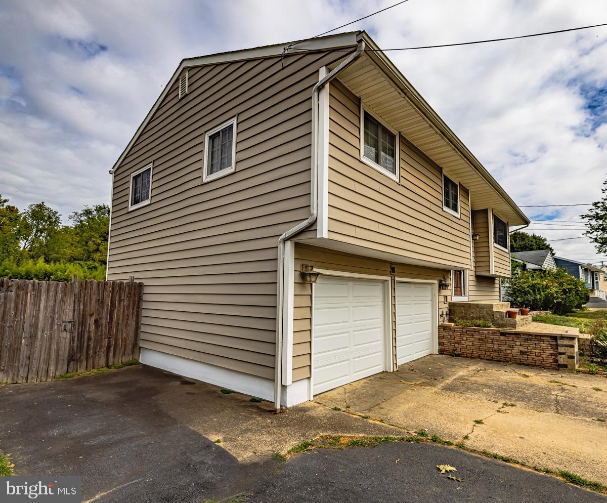 892 Estates Boulevard Hamilton, NJ 08690 - Photo 2 of 36 a front view of a house with a garage