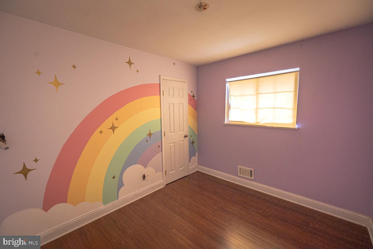 892 Estates Boulevard Hamilton, NJ 08690 - Photo 26 of 36 a view of a room with wooden floor and windows