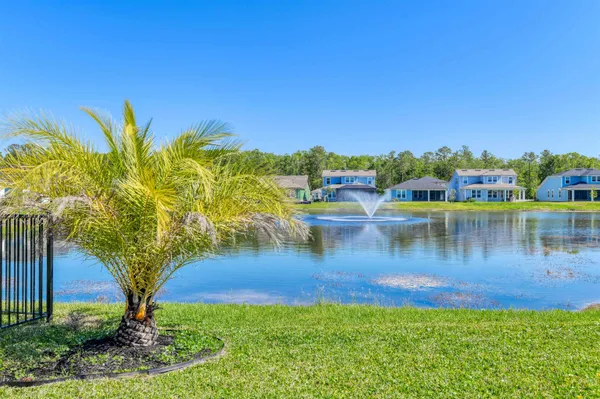 a view of a lake with a yard