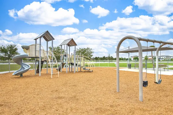 a view of swimming pool with outdoor seating and plants