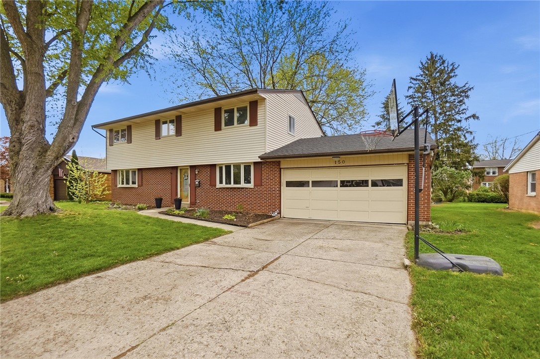 150 Littlejohn Road Troy, OH 45373 - Photo 2 of 40 This charming residence features a well-maintained exterior and inviting front landscaping.