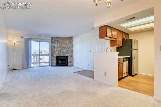 a kitchen with a sink cabinets and appliances