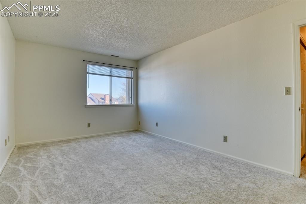 916 Tenderfoot Hill Road, Unit 101 Colorado Springs, CO 80906 - Photo 27 of 42 an empty room with a window