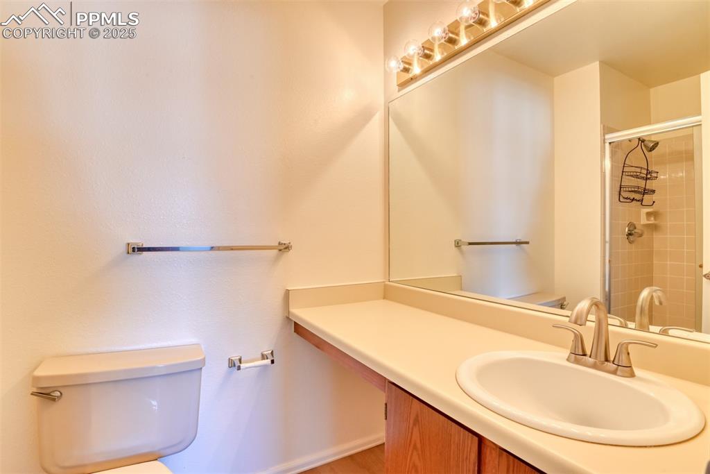 916 Tenderfoot Hill Road, Unit 101 Colorado Springs, CO 80906 - Photo 28 of 42 a bathroom with a sink a toilet and shower
