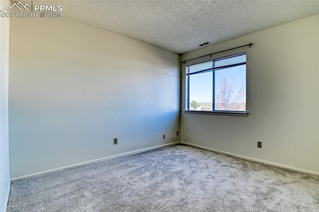 916 Tenderfoot Hill Road, Unit 101 Colorado Springs, CO 80906 - Photo 30 of 42 a view of an empty room with a window