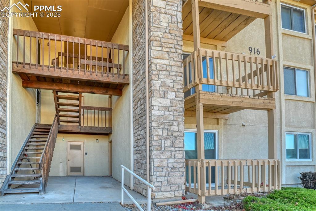 916 Tenderfoot Hill Road, Unit 101 Colorado Springs, CO 80906 - Photo 3 of 42 a view of a brick house with large windows