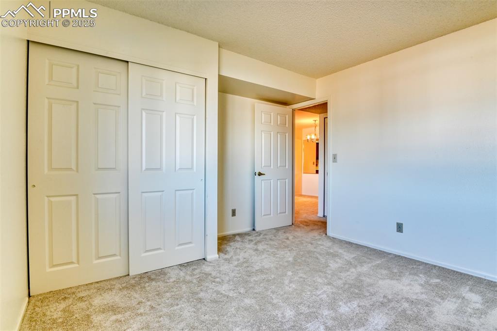 916 Tenderfoot Hill Road, Unit 101 Colorado Springs, CO 80906 - Photo 32 of 42 an empty room with an entryway