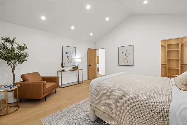 a bed room with a bed and a couch