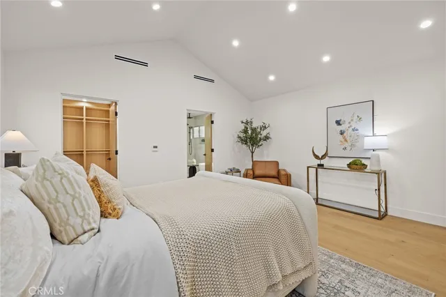 a bathroom with a double vanity sink a mirror and a shower