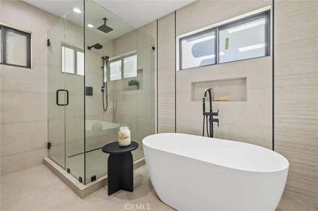 a view of walk in closet with wooden floor