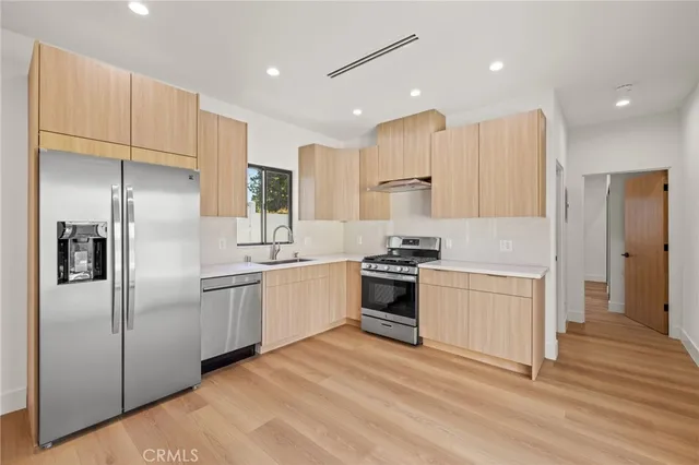 a view of an empty room with glass door