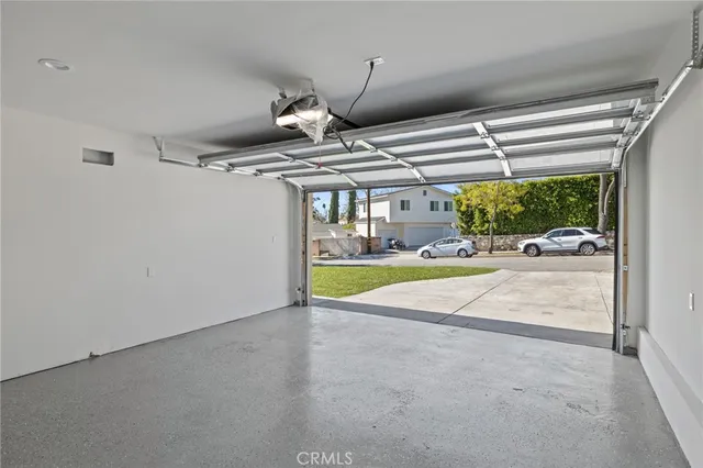 an aerial view of residential house with yard and swimming pool
