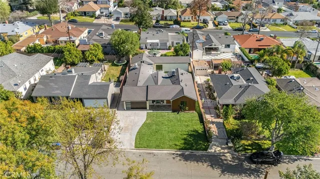 an aerial view of residential house with outdoor space