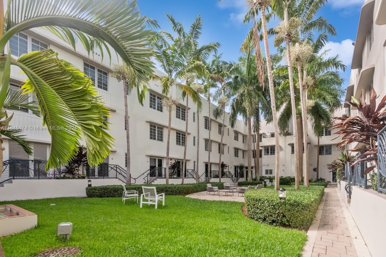 435 21st Street, Unit 310 Miami Beach, FL 33139 - Photo 18 of 28 a garden with palm trees