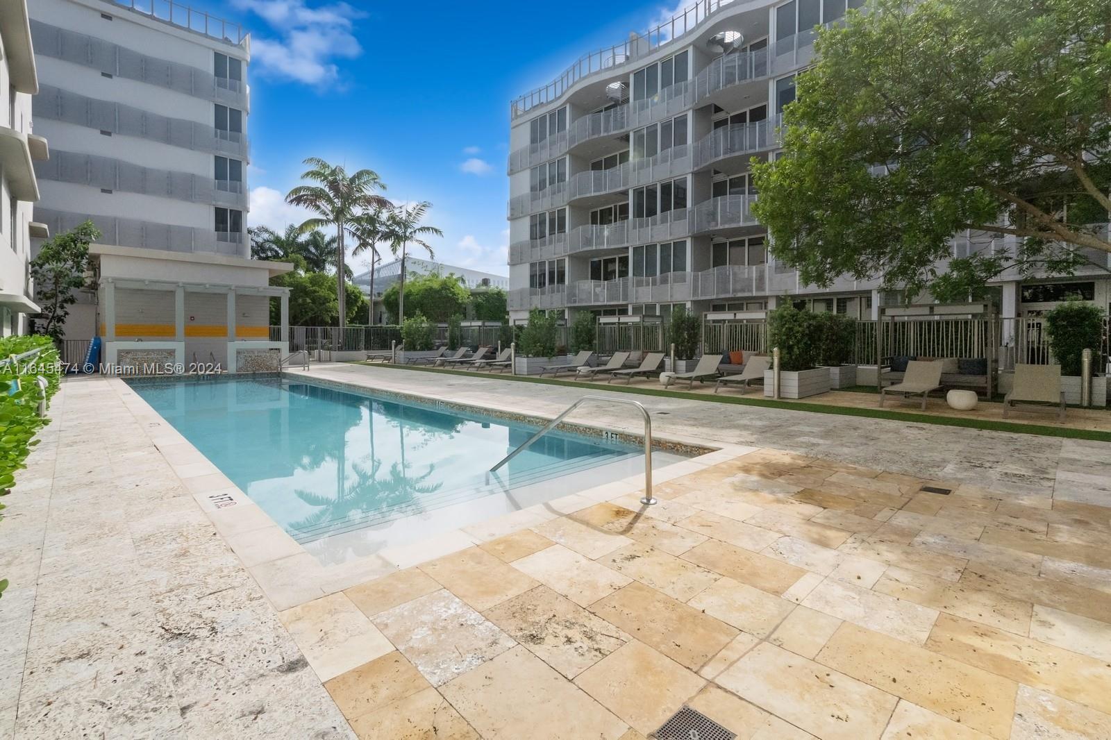 435 21st Street, Unit 310 Miami Beach, FL 33139 - Photo 19 of 28 a view of a swimming pool with a patio