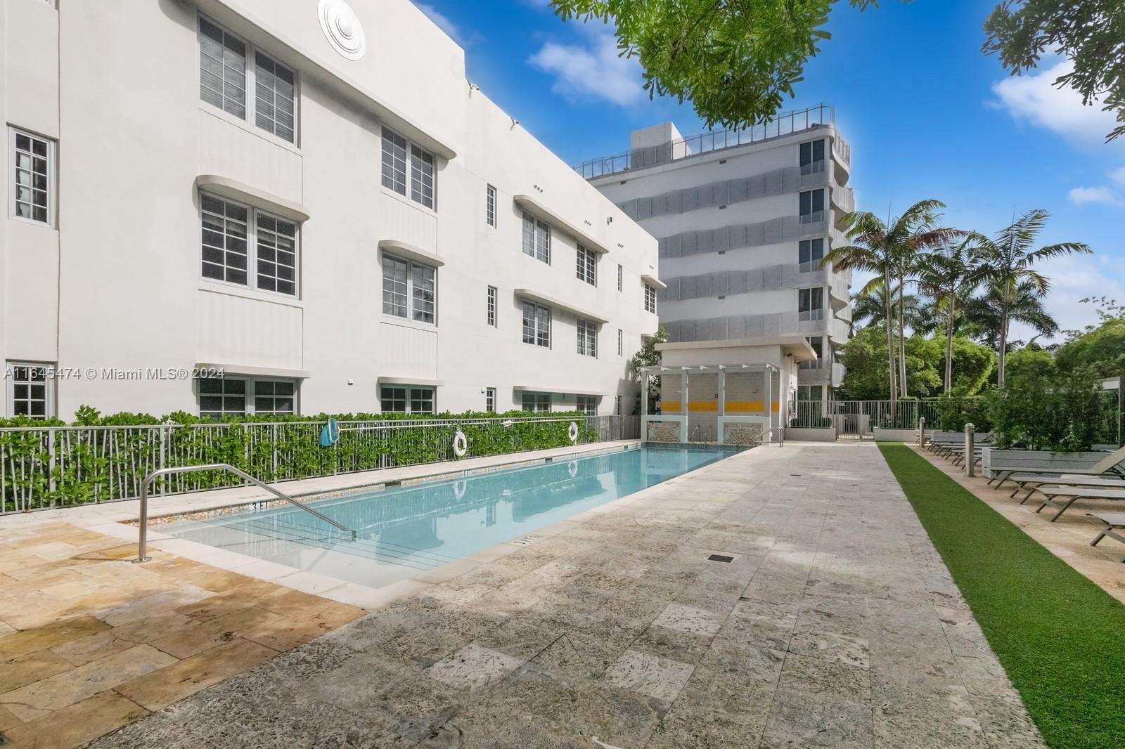 435 21st Street, Unit 310 Miami Beach, FL 33139 - Photo 21 of 28 a view of a building with a yard