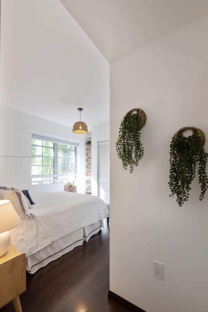 435 21st Street, Unit 310 Miami Beach, FL 33139 - Photo 8 of 28 a bedroom with a bed dresser and window