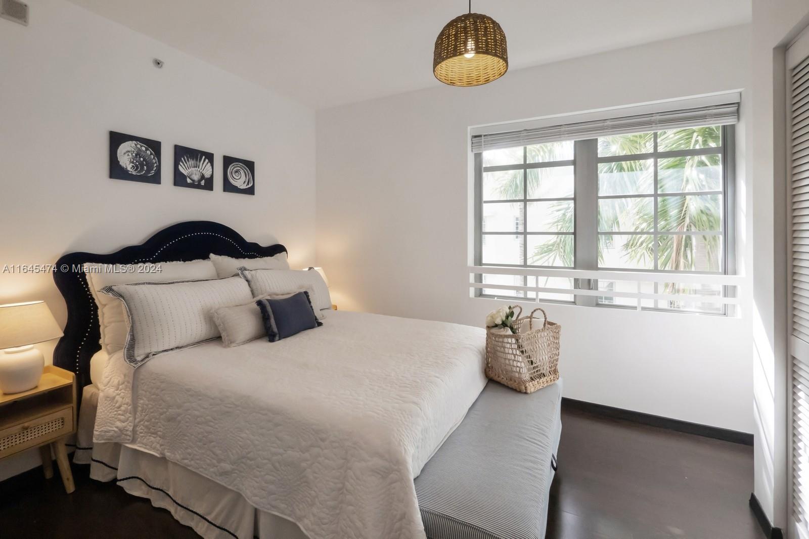 435 21st Street, Unit 310 Miami Beach, FL 33139 - Photo 9 of 28 a bedroom with a bed and window