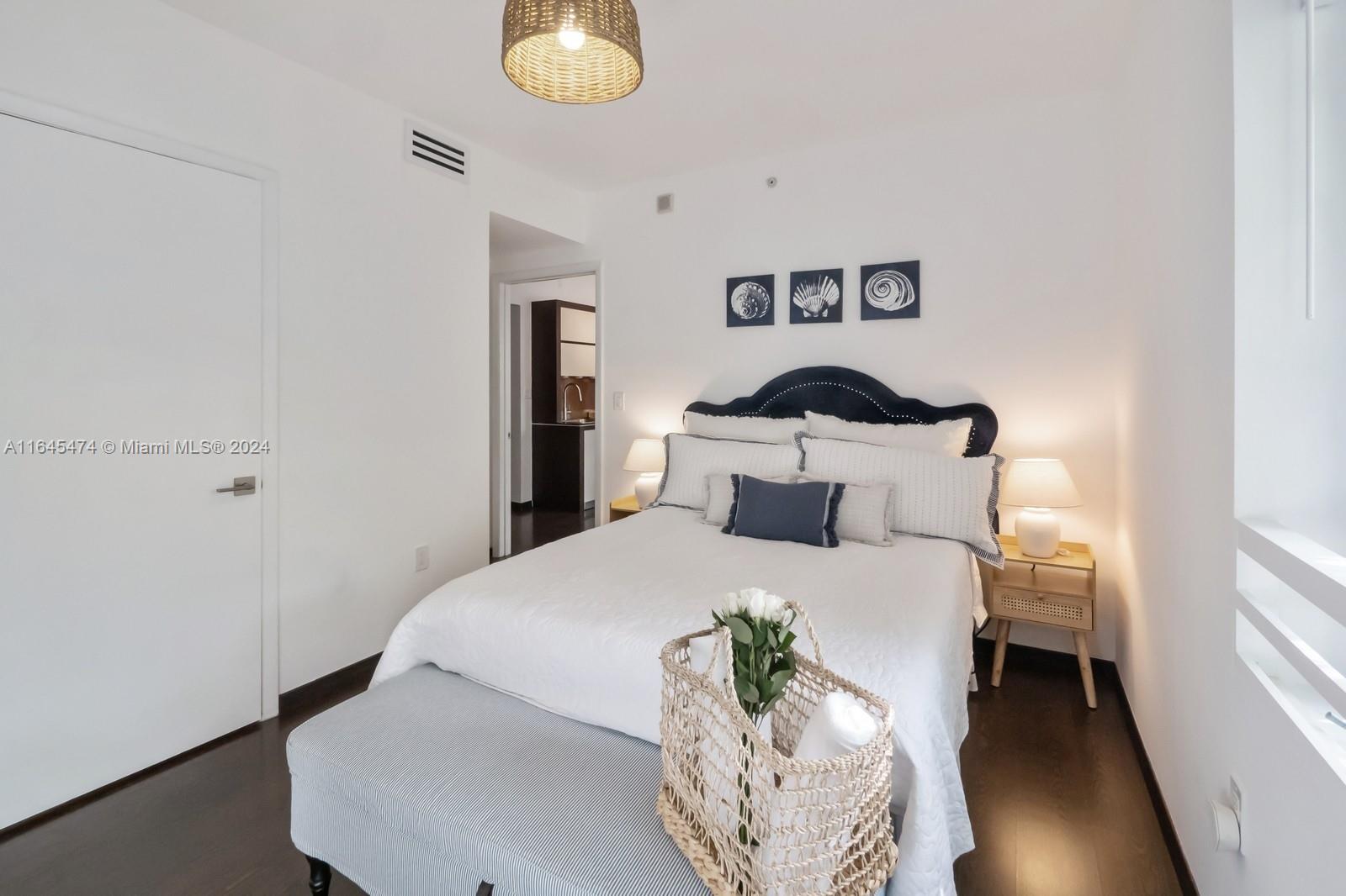 435 21st Street, Unit 310 Miami Beach, FL 33139 - Photo 10 of 28 a bedroom with a bed and a window