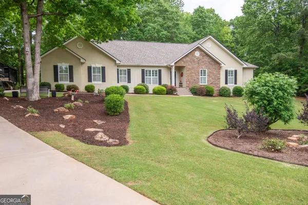 a front view of a house with a yard