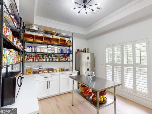 a bedroom with a bed and cabinets