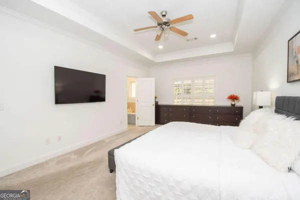 a bathroom with a toilet a sink a mirror and vanity