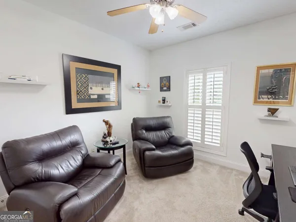 a workspace with furniture and screen