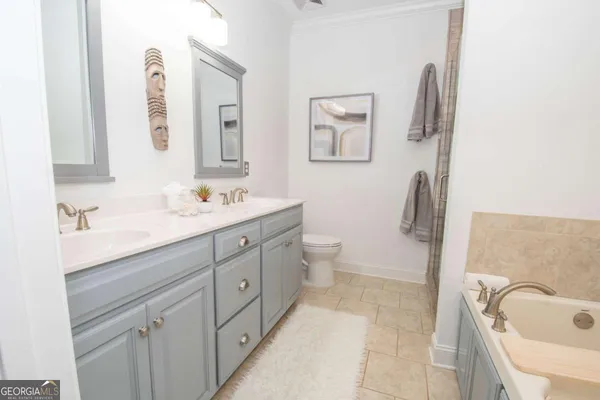 a bathroom with a tub and sink