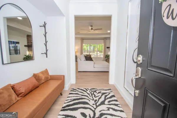 a bedroom with furniture and a wooden floor