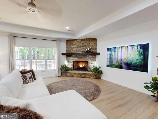 a living room with furniture and a fireplace