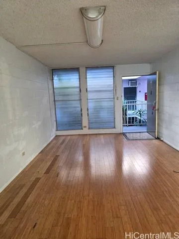a view of a livingroom with wooden floor
