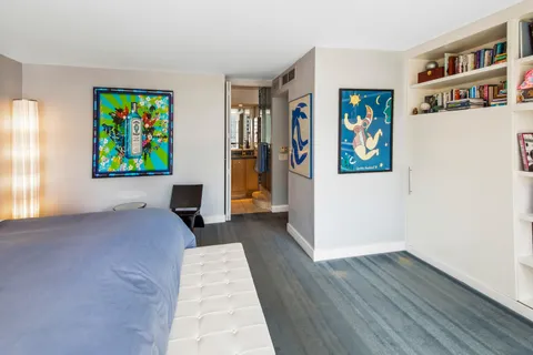 a bathroom with a toilet sink and shower