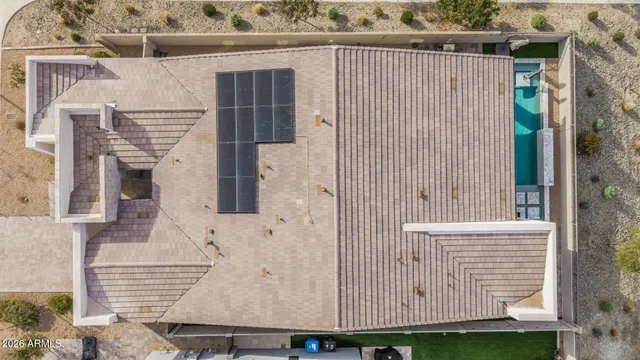 a kitchen with kitchen island stainless steel appliances a sink a stove and a refrigerator