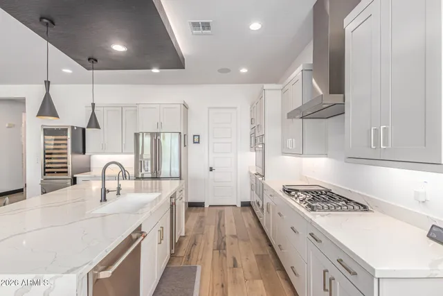 a bedroom with a bed and a dresser