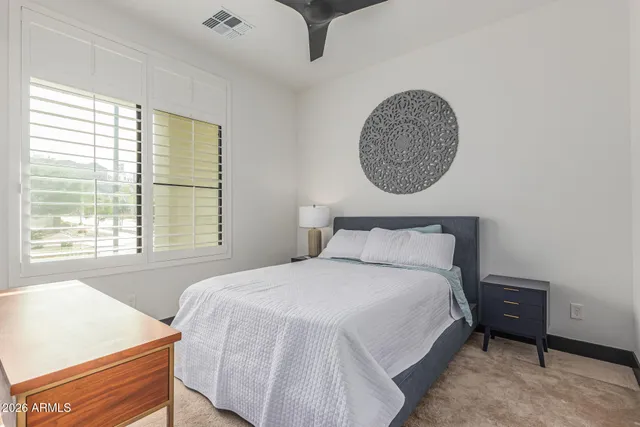 a bathroom with a double vanity sink mirror and toilet